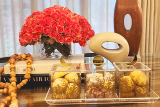 image Gold Moon and Gold Sun Dessert Box with gold printed pattern on Acrylic Tray on dining table setting with books and flowers and decoration.